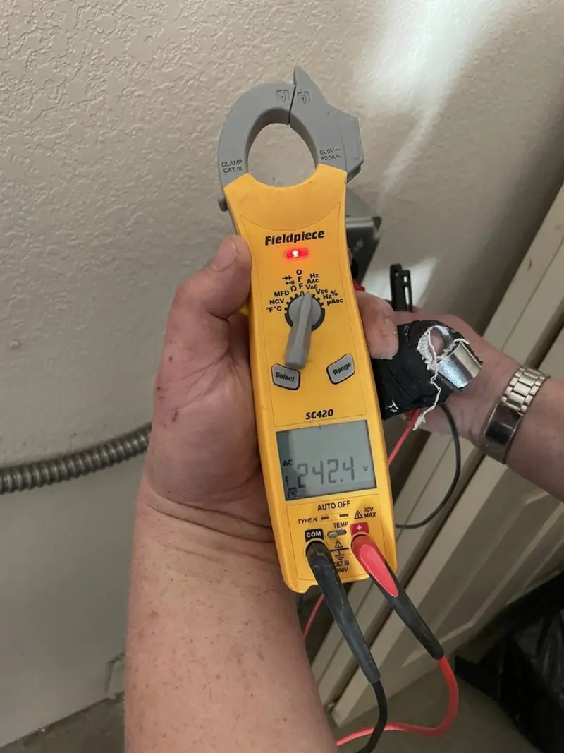 Voltage testing with clamp meter during Ceiling Fan Installation in Big Flats